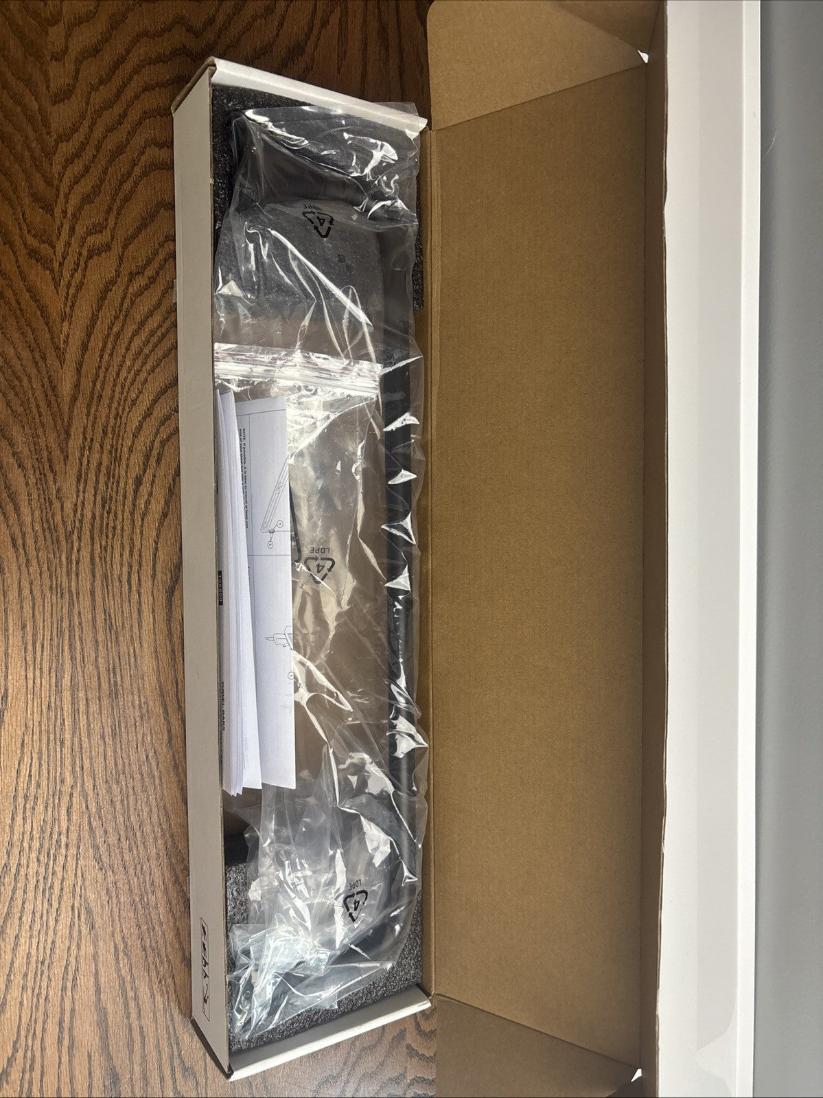 Delta 73318 18" Wall Mounted Towel Bar - Black.